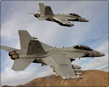 A pair of Boeing EA-18G Growlers, XE 573 166857 and XE 571 166855 of the VX-9 "Vampires" bank over the desert