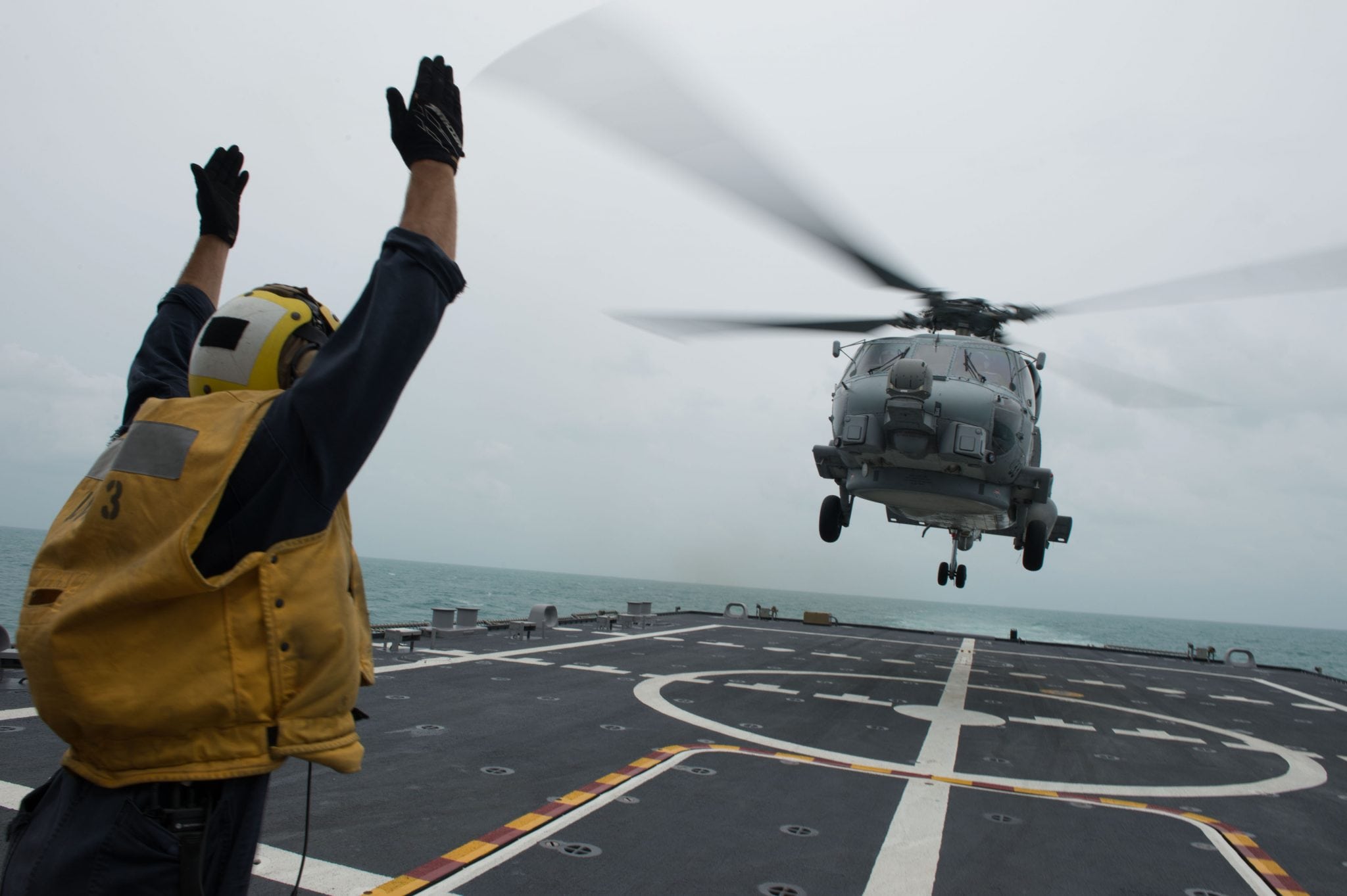 MH-60R Sea Hawk helicopter onducting helicopter search and recovery operations as part of the Indonesian-led efforts to locate missing AirAsia Flight QZ8501