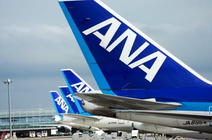 A row of aircraft with ANA livery