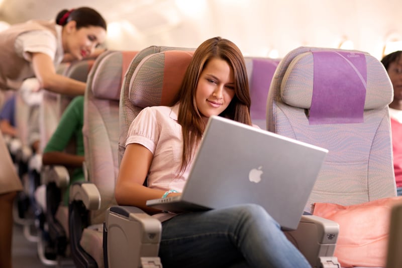 Passenger accessing in-flight Wi-Fi
