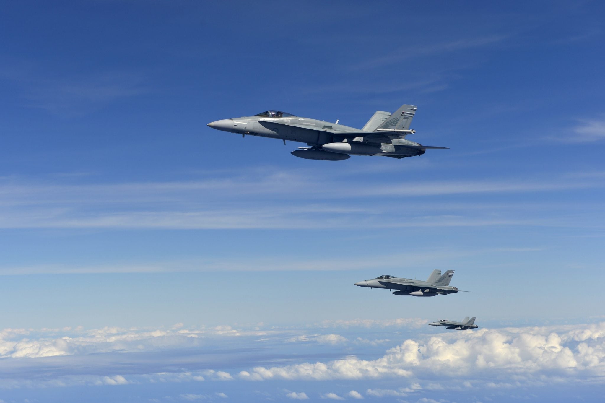 Three RAAF FA-18 Hornets in formation after refueling U.S. Air Force photo by Senior Airman Matthew Bruch