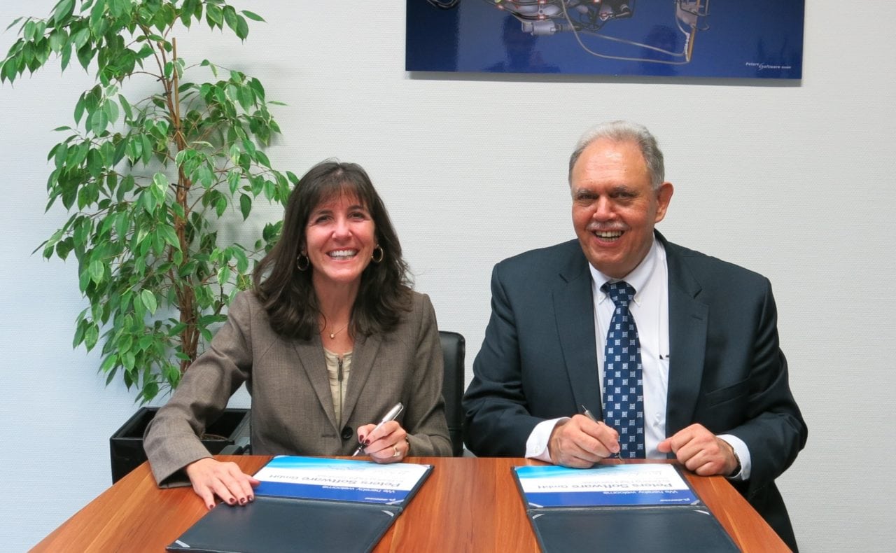 Boeing Flight Services Vice President Sherry Carbary and Wilfried Peters, the director of Ab-Initio Training Programs at the Boeing Flight Services Signing