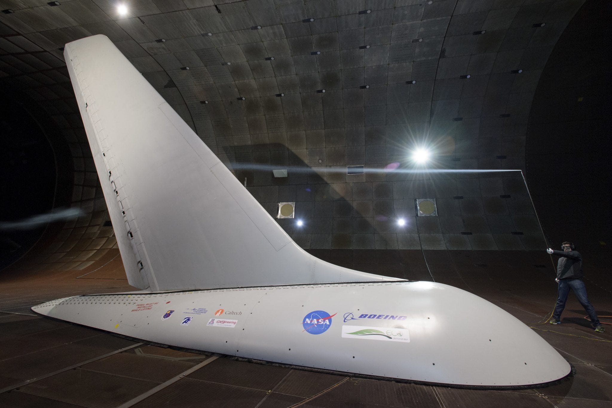 Researchers with NASA's Environmentally Responsible Aviation project coordinated wind-tunnel tests of an Active Flow Control system — tiny jets installed on a full-size aircraft vertical tail that blow air — to prove they would provide enough side force and stability that it might someday be possible to design smaller vertical tails that would reduce drag and save fuel