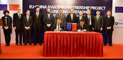Representatives from each country sign the EU and China Aviation Partnership Project