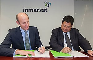 Inmarsat CEO, Rupert Pearce, and MCN Vice President of Sales & Marketing, Mr. Song Zhen, signing an agreement for MCN to become a Global Xpress Value Added Reseller (GX VAR) in China in April 2015