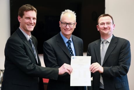 EASA And CFM officials hold certificate certifying the LEAP 1C engine. Photo: EASA