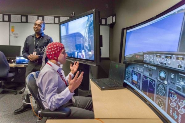 A demonstration of the use of human brain waves to provide inputs for flight controls inside of Honeywell's Advanced Technology lab for neural sensing technology. Photo: Honeywell Aerospace.
