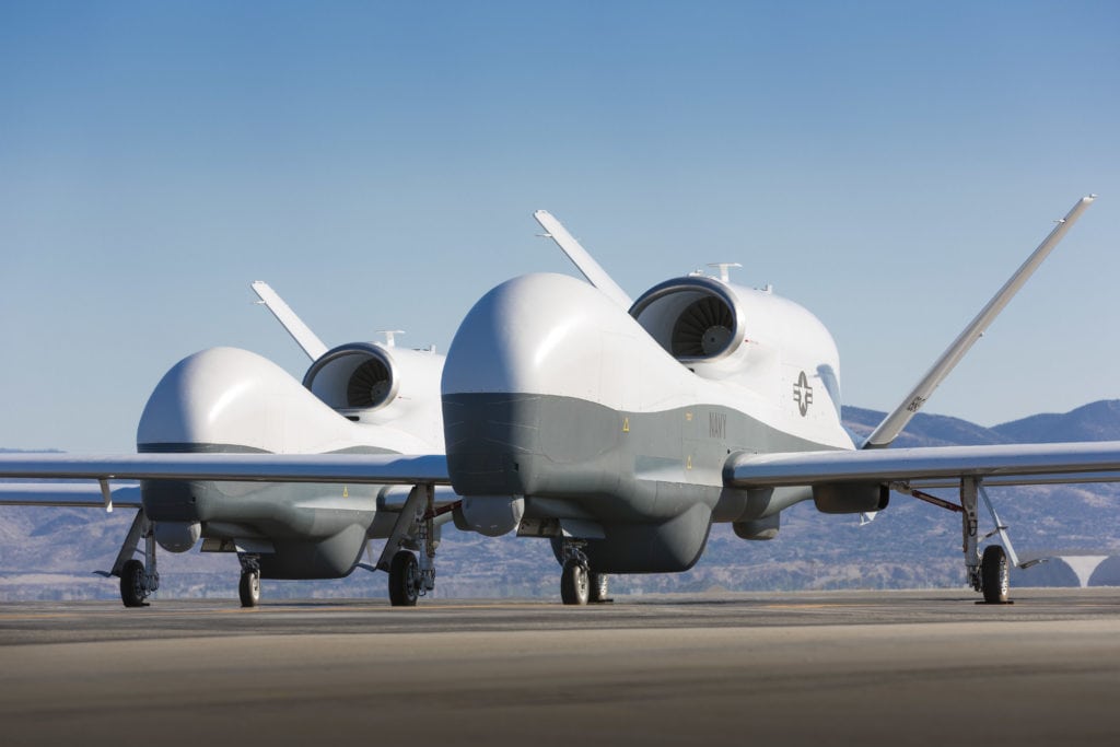 130521-O-ZZ999-111 PALMDALE, Calif. (May 21, 2013) Two Northrop Grumman MQ-4C Triton unmanned aerial vehicles are seen on the tarmac at a Northrop Grumman test facility in Palmdale, Calif. Triton is undergoing flight testing as an unmanned maritime surveillance vehicle. (U.S. Navy photo courtesy of Northrop Grumman by Chad Slattery/Released)