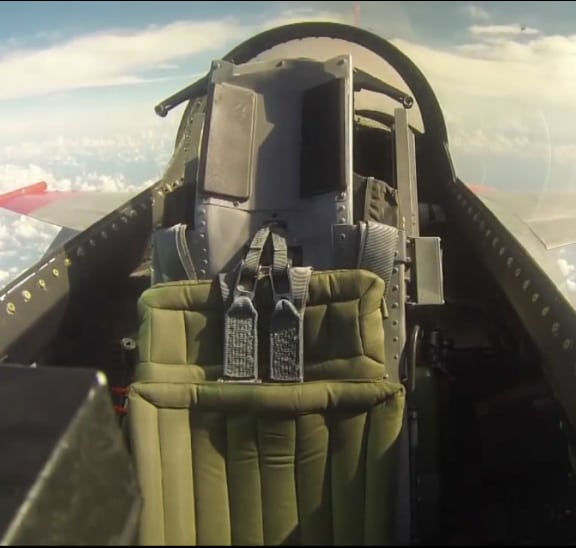 A pilot remotely controls a Q-F4 Phantom as it takes off from the