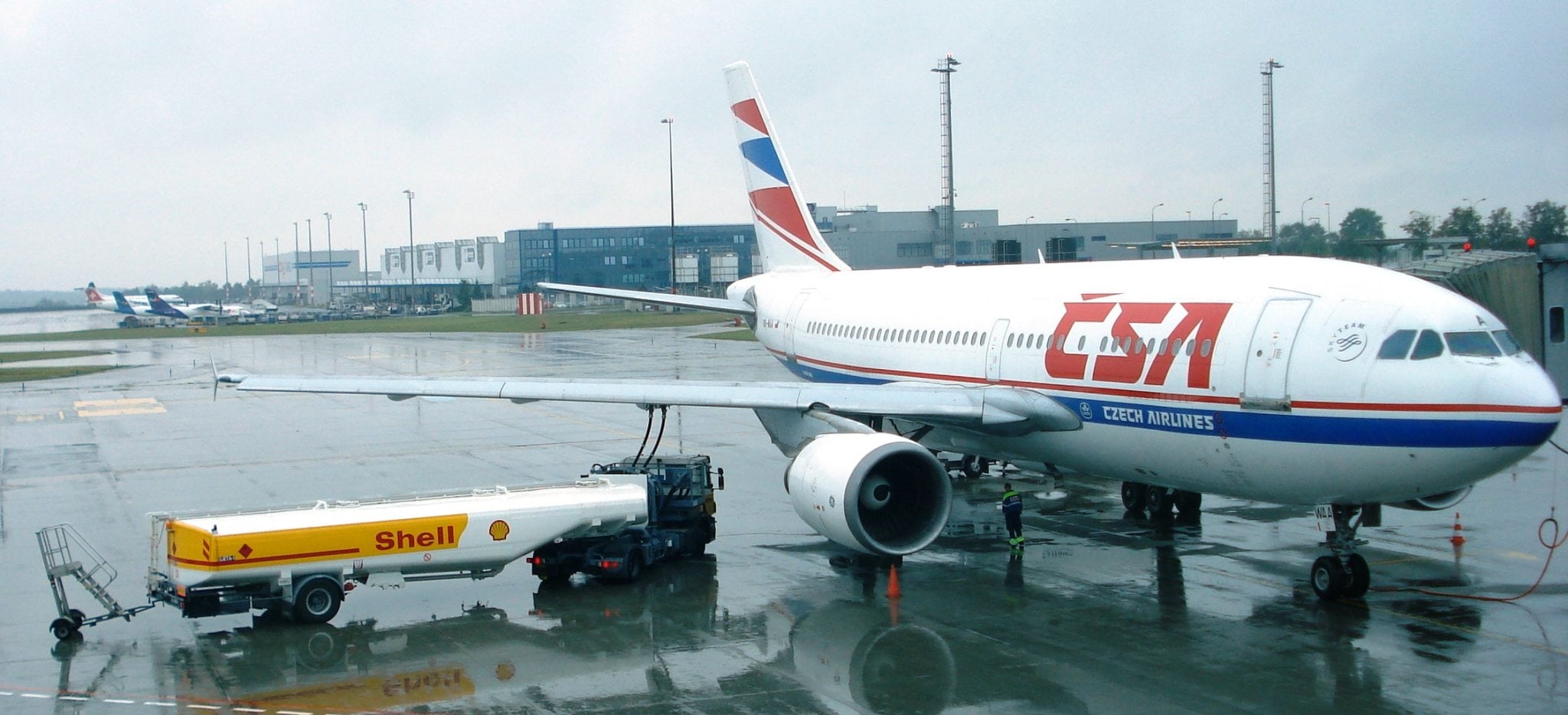 Shell Tanker refueling aircraft on runway