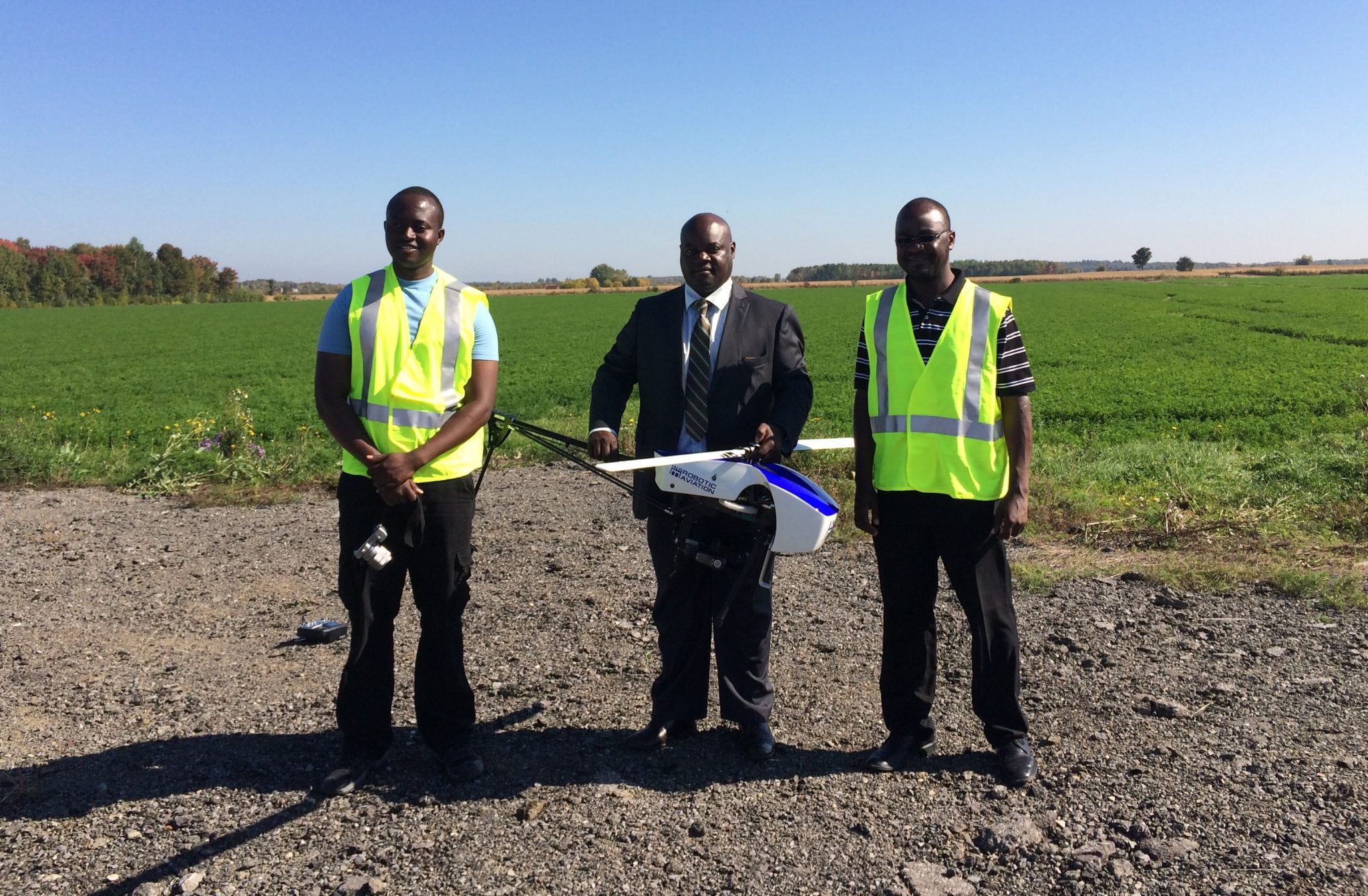 Two trainees with First Secretary Enock Aroni of the Kenyan High Commission