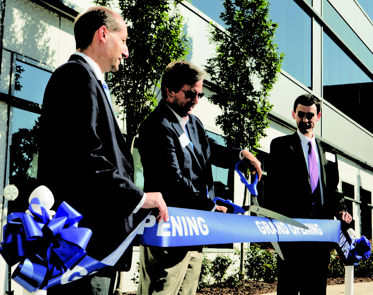 UTC Aerospace executives inaugurate the new facility with a ribbon-cutting ceremony