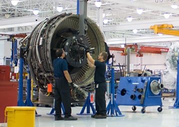 Workers at a Lockheed Martin Commercial Engine Solutions facility