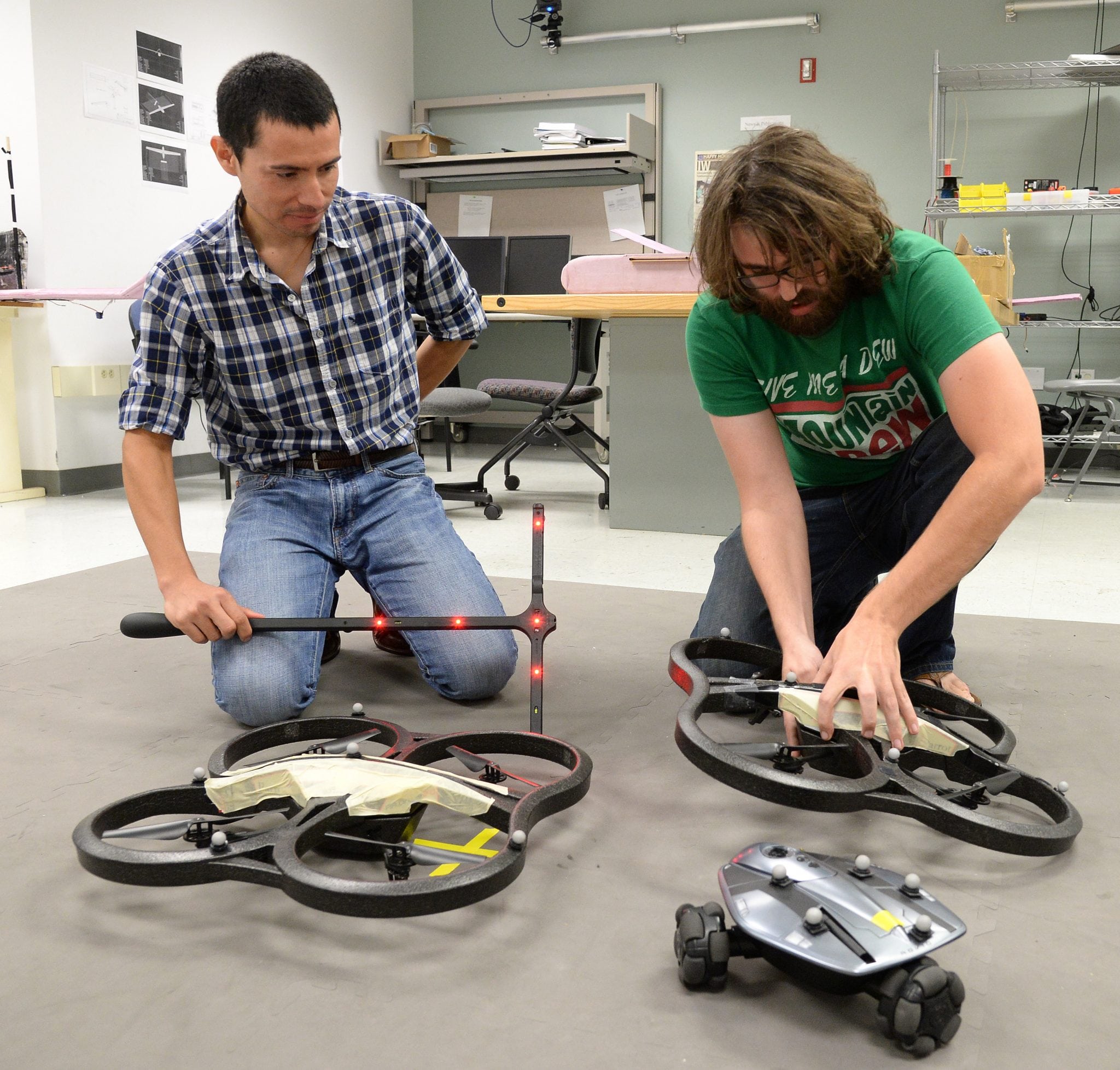 Luis Garcia Carrillo works with a student to test unmanned aerial vehicles capable of vertical flight