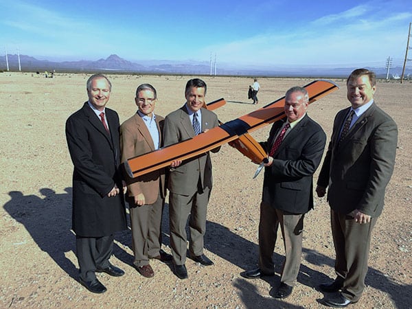 Pictured in the photo from left to right: Steve Hill, Nevada Governor’s Office of Economic Development (GOED), Representative Joe Heck , Governor of Nevada, Brian Sandoval, Sensurion Aerospace CEO, Captain Joe Burns, Senator Dean Heller hold Magpie MP-1 UAS