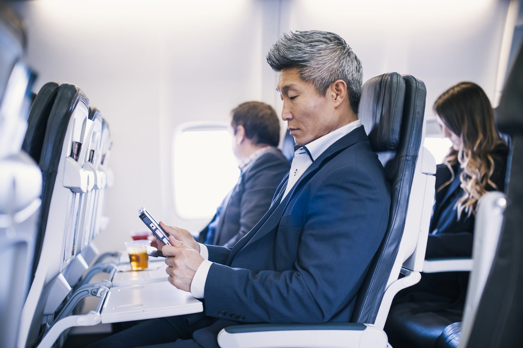 Alaska Air passenger accessing IFE via their personal tablet