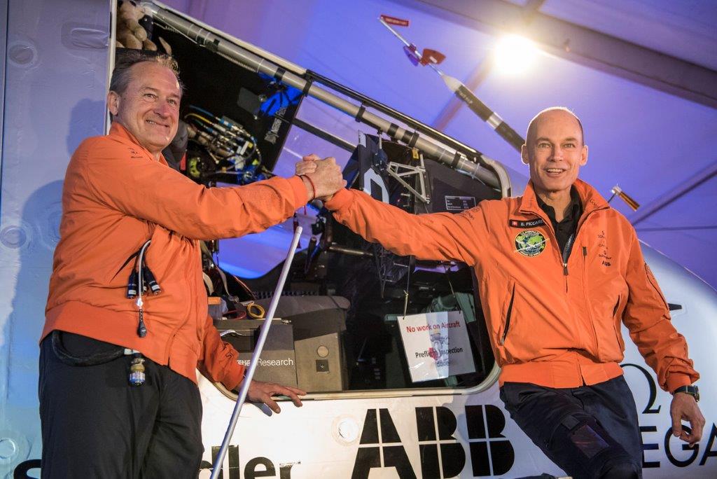 Co-pilots Andre Borschberg and Bertrand Piccard board the Solar Impulse 2 for the first leg of the round-the-world flight