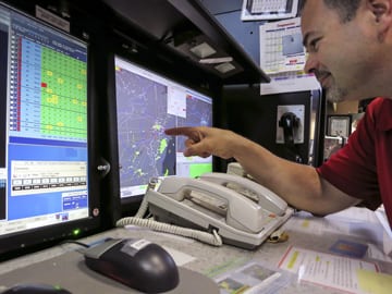 FAA user consults weather-aware decision support tools in the New York Air Route Traffic Control Center