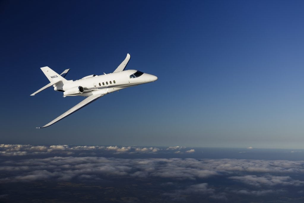 Aerial photography of the Textron Cessna Latitude business jet flying over Keystone Lake, OK. Mid-Continent Airport (ICT) Wichita KS USA