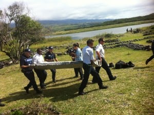 Investigators remove debris that may belong to the missing MH 370