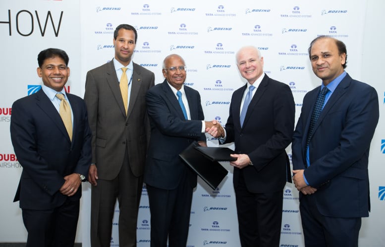 Tata Advanced Systems Chairman S. Ramadorai (third from left) and Tom Bell, senior vice president, Global Sales & Marketing, Boeing Defense, Space & Security (second from right) sign the agreement to create a joint venture. Boeing International President Marc Allen (second from left), Boeing India President Pratyush Kumar (left) and Tata Advanced Systems CEO Sukaran Singh (right) attended the signing ceremony