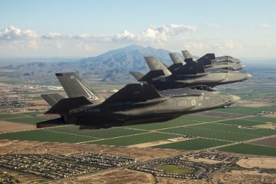 Four F-35 Lighting II aircraft fly over Luke Air Force Base, Arizona