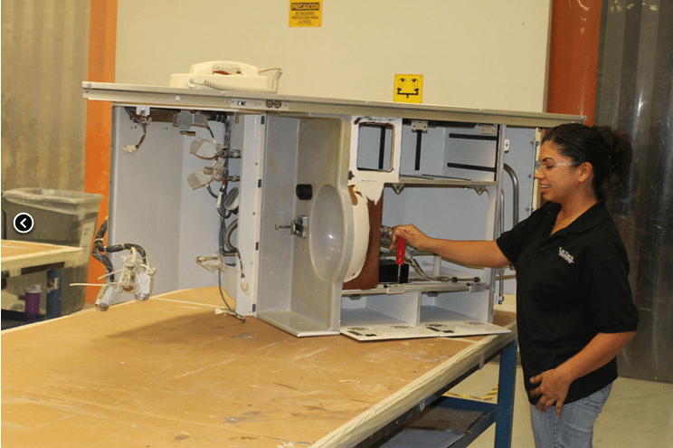 InTech employee working on an aircraft system