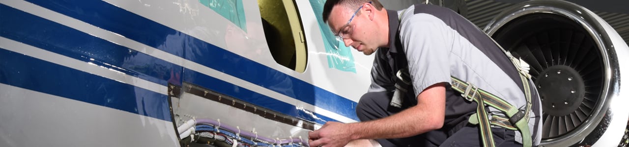 Technician working on aircraft