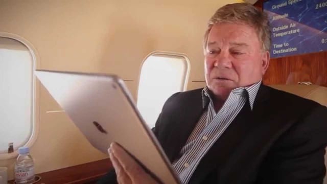 Actor William Shatner using Bombardier’s WAVE IFC solution in flight