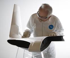 Employee working on aircraft wing tip