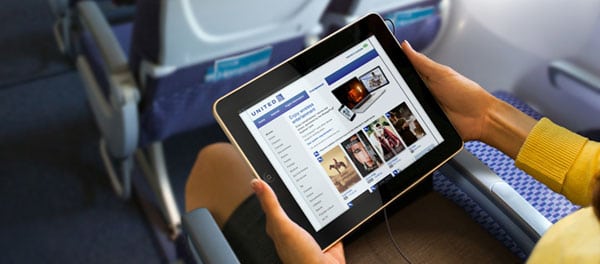 Passenger using an iPad in flight