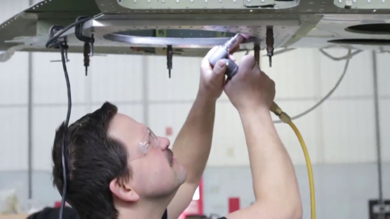 Constant Aviation maintenance technician working on an aircraft