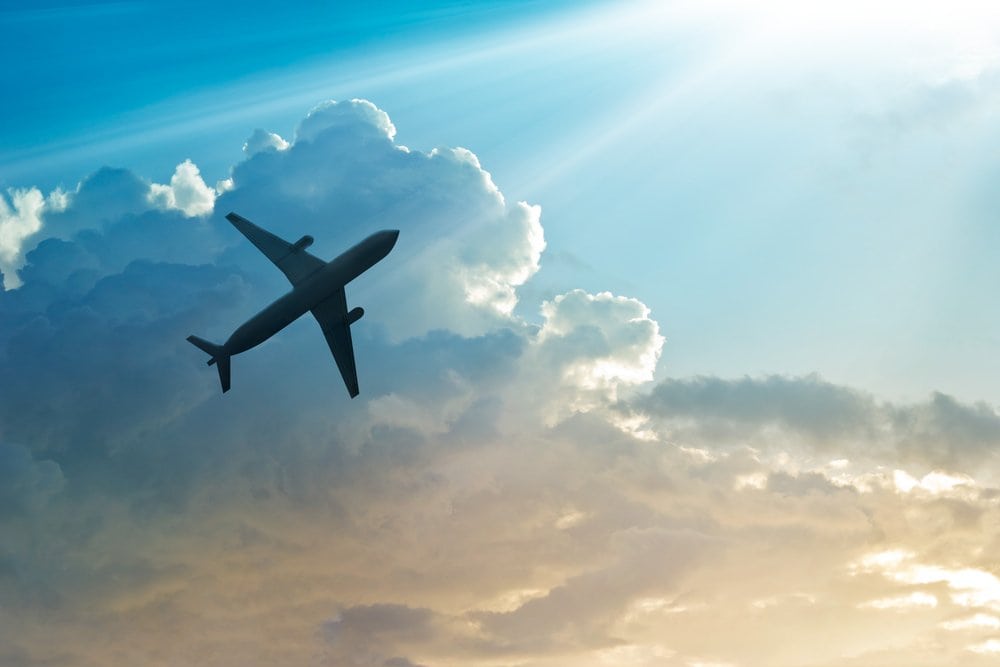 Airplane silhouette in sky