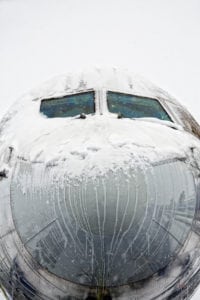 Nose of a Boeing 757 covered with snow and Ice 