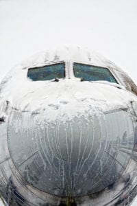 Nose of a Boeing 757 covered with snow and Ice