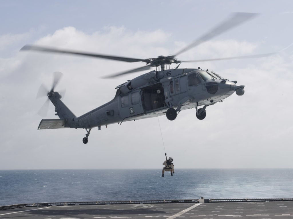 170214-N-WV703-103 SOUTH CHINA SEA (Feb. 14, 2017) Naval Aircrewman (Helicopter) 2nd Class Kevin Brodwater, a search and rescue swimmer assigned to the littoral combat ship USS Coronado (LCS 4), is lowered from an MH-60S Sea Hawk helicopter onto the flight deck during a search and rescue medical evacuation drill. Coronado is a fast and agile warship tailor-made to patrol the region's littorals and work hull-to-hull with partner navies, providing the U.S. 7th Fleet with the flexible capabilities it needs now and in the future. (U.S. Navy photo by Mass Communication Specialist 2nd Class Amy M. Ressler/Released)