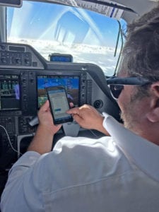 Crewmember using Blue Sky Network in cockpit. Photo: Blue Sky Network.