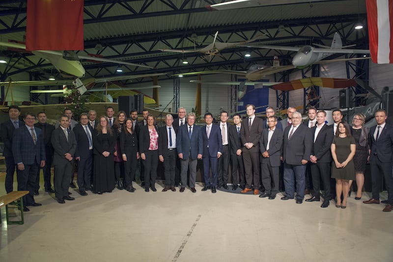 Christian Dries and Bin Chen (center) with Diamond Austria and Wanfeng Aviation Industry employees and guests. Photo courtesy of Diamond Aircraft Group
