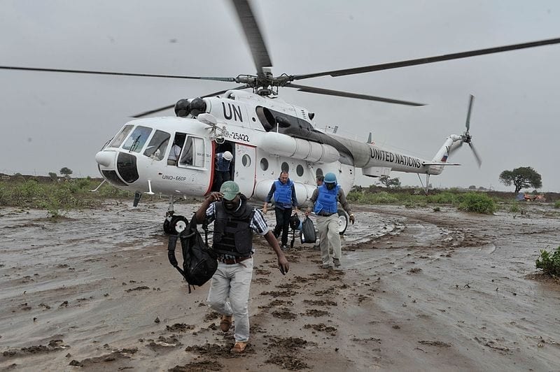 United Nations workers in Somalia disembark from an Mi-8MTV helicopter in November 2014. (United Nations)