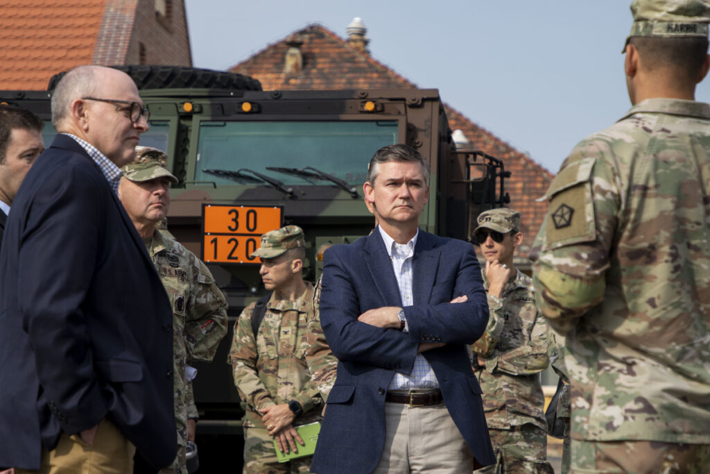 The Honorable Douglas R. Bush, assistant secretary of the army for acquisition, logistics and technology, receives a briefing of current V Corps operations at Victory Corps Forward, from U.S. Army Command Sgt. Maj. Raymond Harris assigned to V Corps, during a visit to Camp Kościuszko, Poland, Sep. 8, 2022. Photo by Spc. Dean Johnson, 5th Mobile Public Affairs Detachment