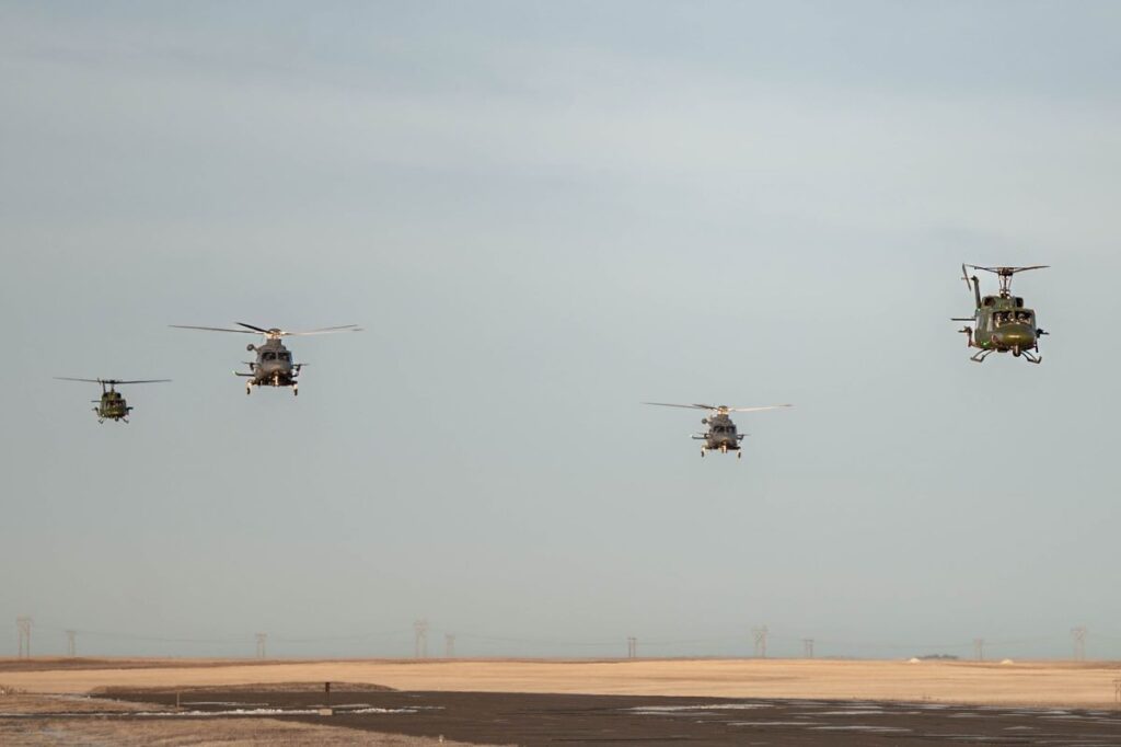 Two UH-1N Hueys with the 40th Helicopter Squadron and two MH-139A Grey Wolf aircraft with the 550th Helicopter Squadron prepare to land at Malmstrom AFB, Mont. on Jan. 28 after an MH-139 Initial Operational Test and Evaluation mission (U.S. Air Force Photo)